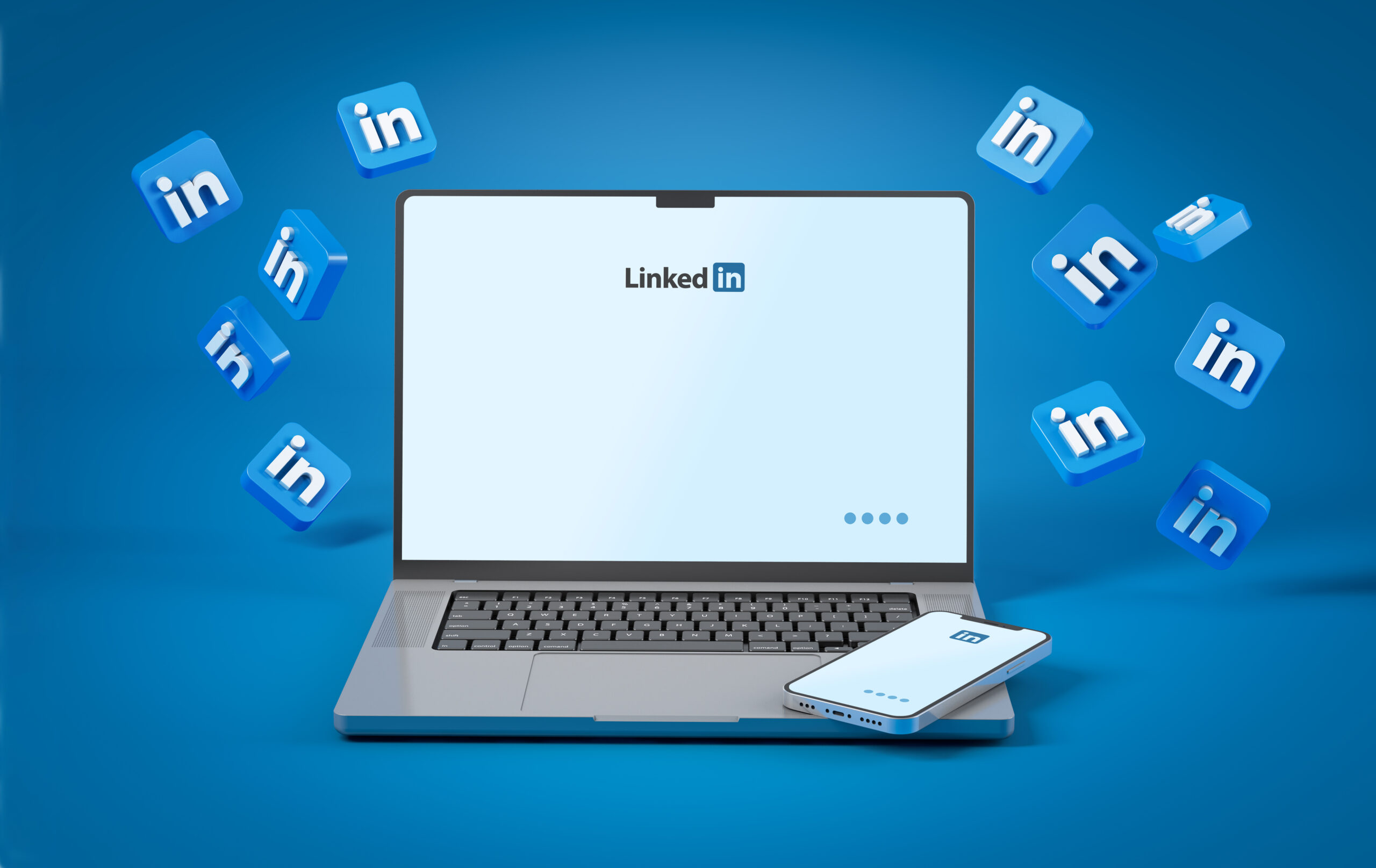 Connectivité professionnelle avec LinkedIn : ordinateur et smartphone, entourés dicônes en mouvement.